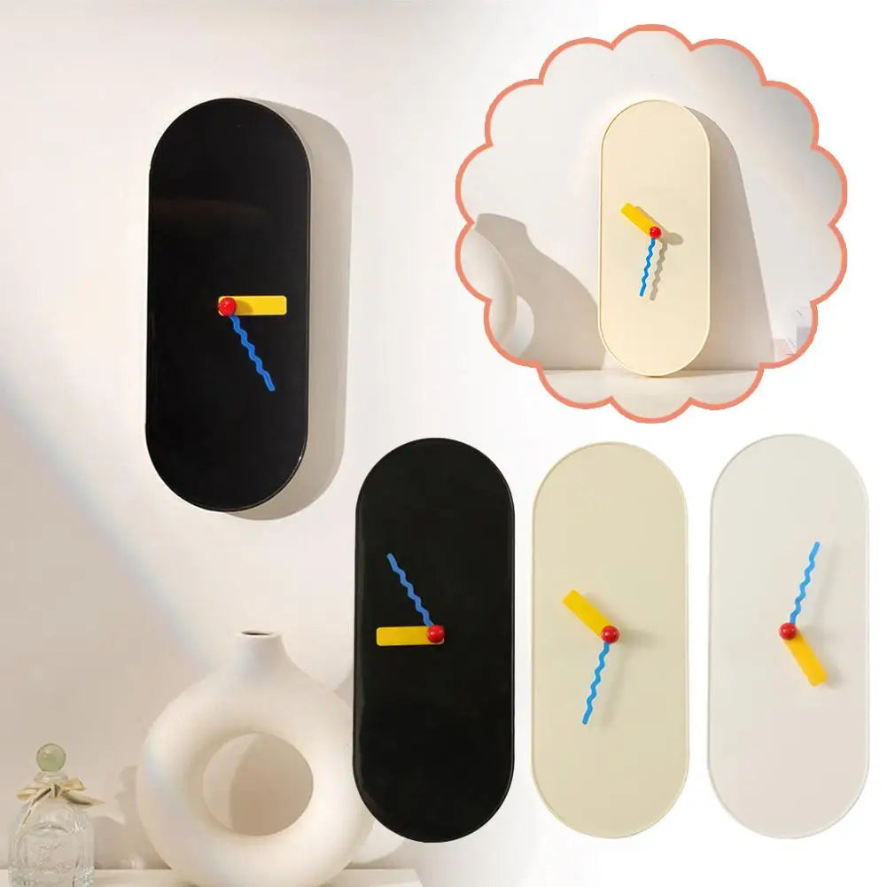 Reloj de pared moderno con agujas de colores