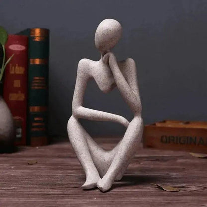 Escultura abstracta de pensador con forma figurativa minimalista