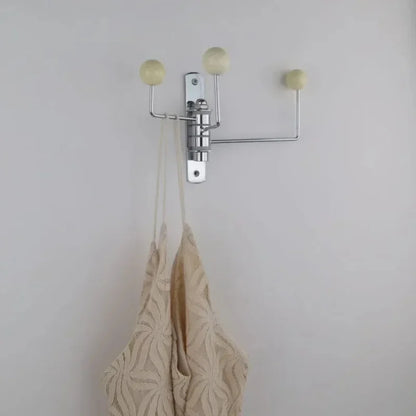 Perchero de pared giratorio con pomos redondos