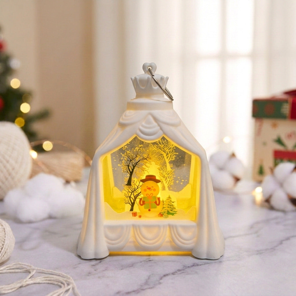 Weihnachtslaterne mit beleuchteter Winterszene
