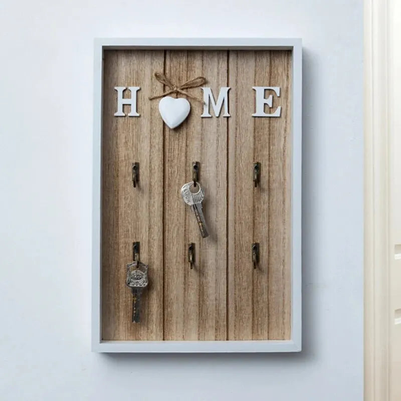 Tablero para llaves de madera con 6 ganchos y la inscripción «Home»