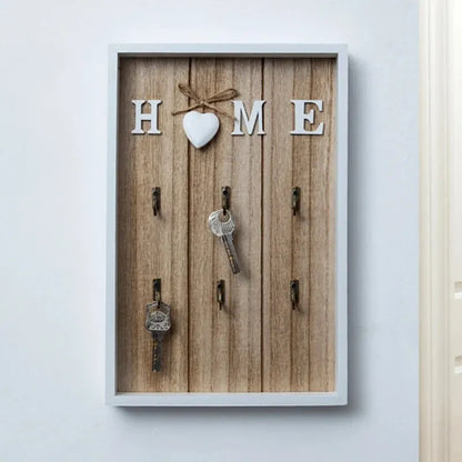 Tablero para llaves de madera con 6 ganchos y la inscripción «Home»