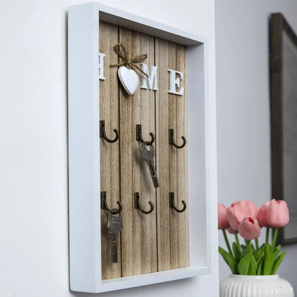 Tablero para llaves de madera con 6 ganchos y la inscripción «Home»