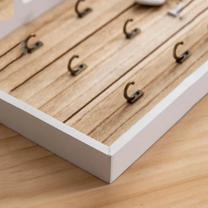 Tablero para llaves de madera con 6 ganchos y la inscripción «Home»