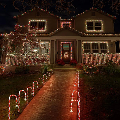 Luces solares navideñas con forma de palito de caramelo: una decoración radiante para las noches festivas.