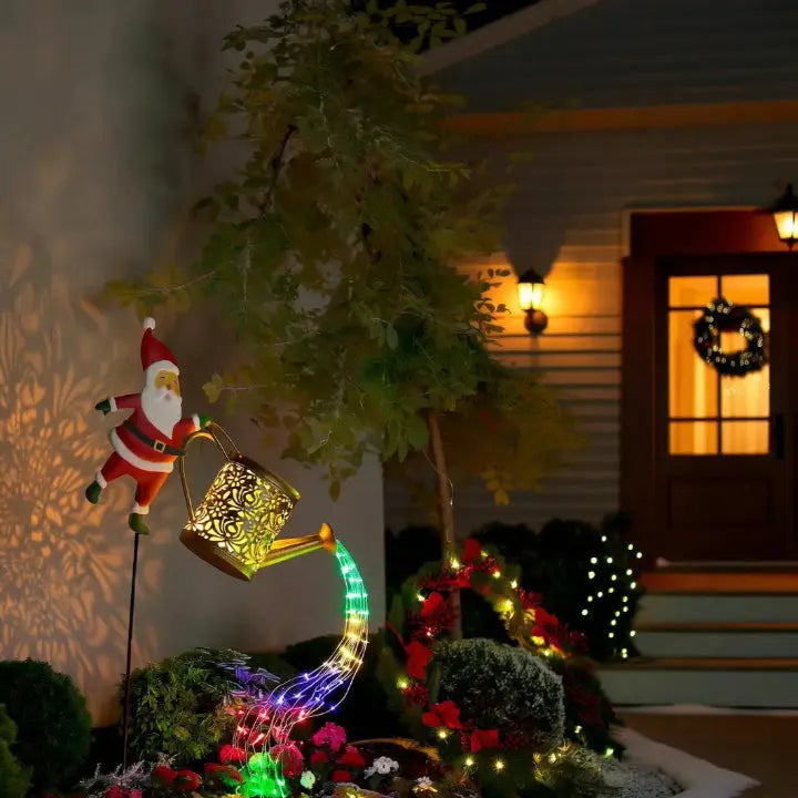 Regador de Natal a energia solar com Pai Natal e cascata de luzes LED multicoloridas