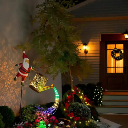 Regador de Natal a energia solar com Pai Natal e cascata de luzes LED multicoloridas