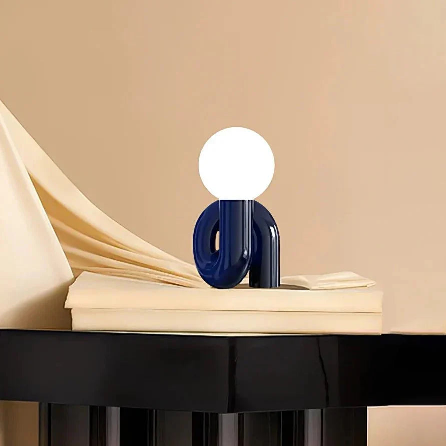 Candeeiro de mesa escultural com esfera de vidro