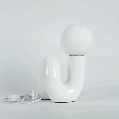 Candeeiro de mesa escultural com esfera de vidro