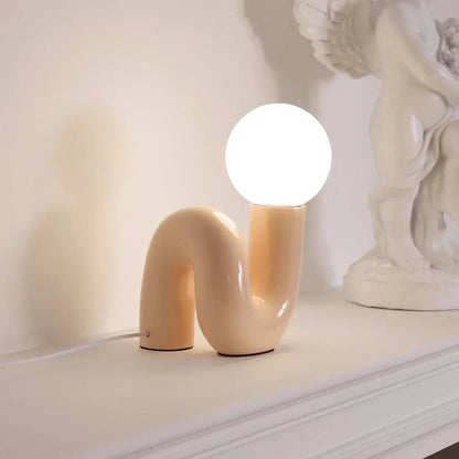Candeeiro de mesa escultural com esfera de vidro