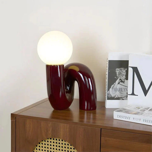Candeeiro de mesa escultural com esfera de vidro