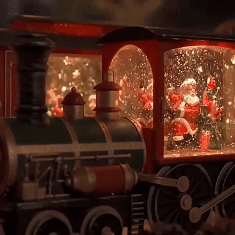 Comboio de Natal iluminado com efeito de neve
