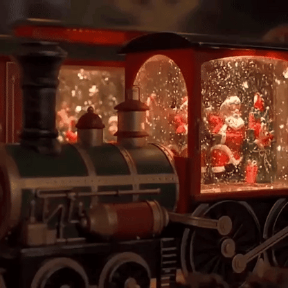 Comboio de Natal iluminado com efeito de neve