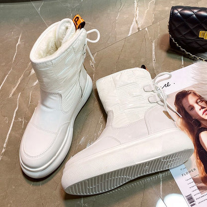 Botas de invierno para mujer con acabado brillante y plataforma