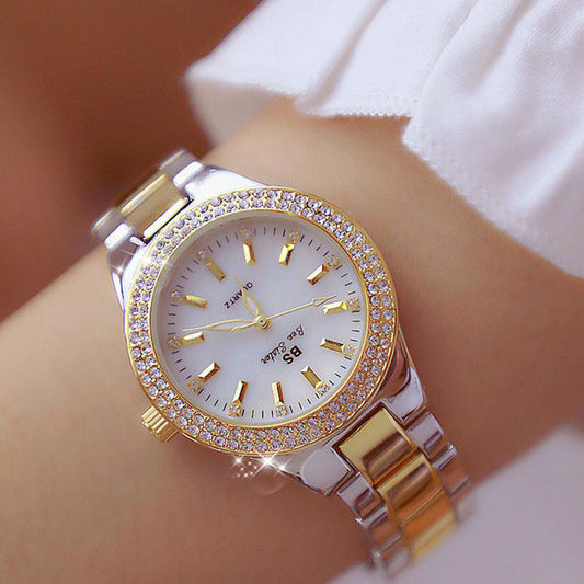 Reloj de pulsera Aurora Luxe para mujer: color dorado con detalles brillantes.