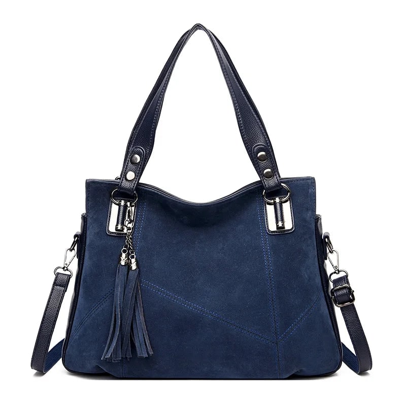 Damenhandtasche mit Schulterriemen und dekorativen Quasten