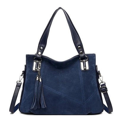 Damenhandtasche mit Schulterriemen und dekorativen Quasten
