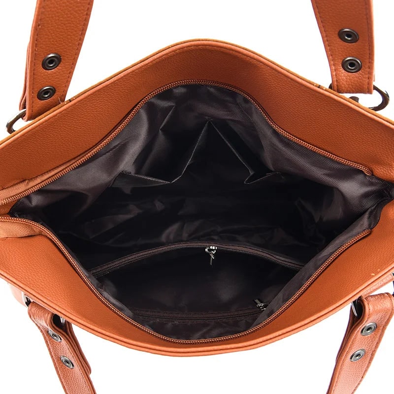 Damenhandtasche mit Schulterriemen und dekorativen Quasten
