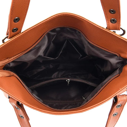 Damenhandtasche mit Schulterriemen und dekorativen Quasten